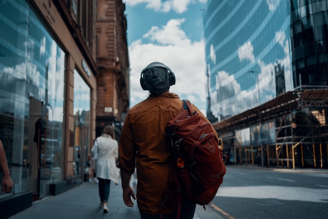 the back of a man walking through Glasgow city centre